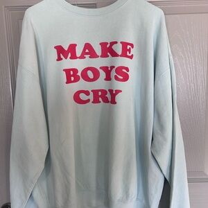 Trendy Light Blue Crew Neck Sweater with Bold Red Text